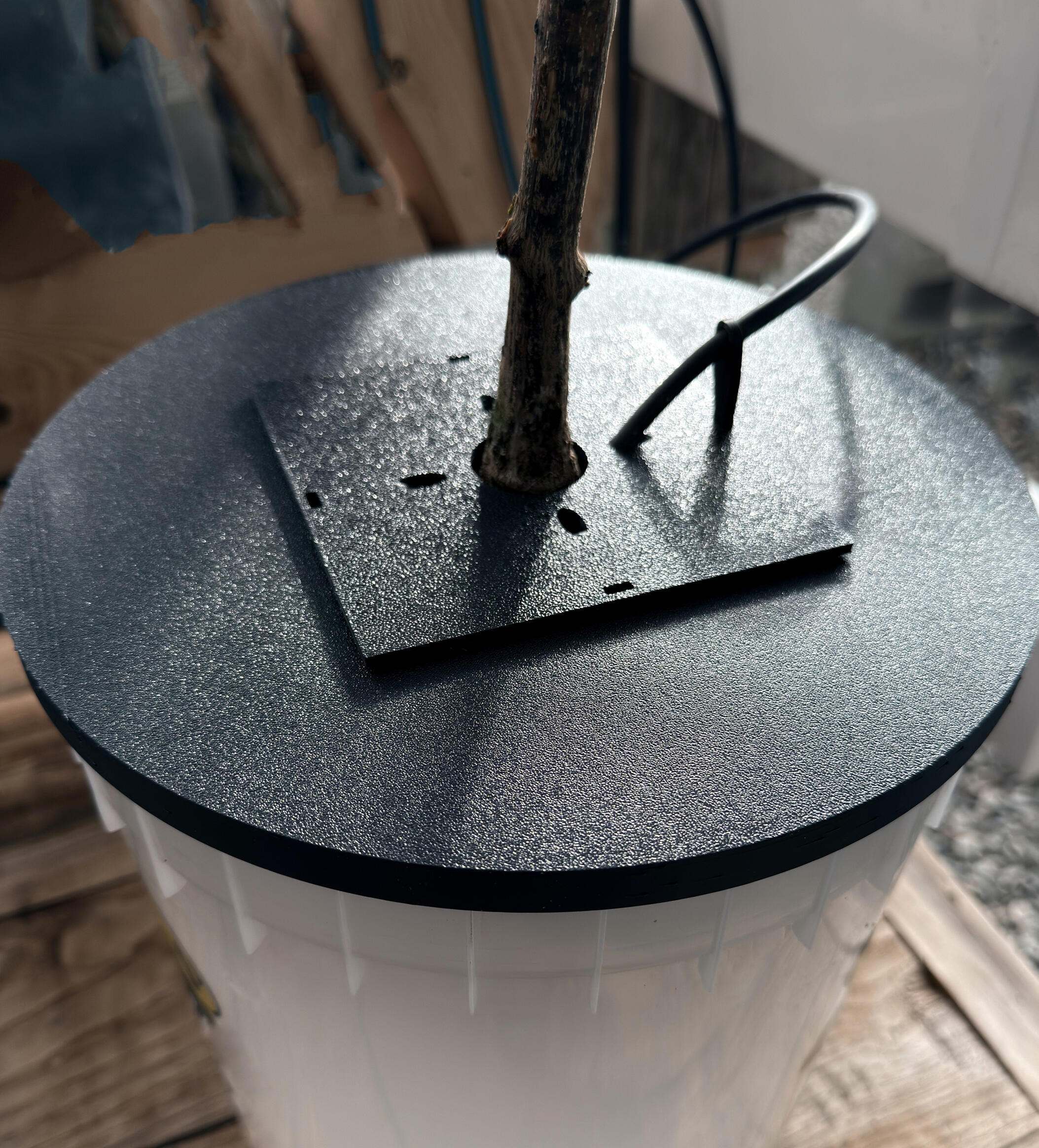 10 inch square on round GroCup in place on a Dutch Bucket complete with optional cover and secured in place nutrient supply tube